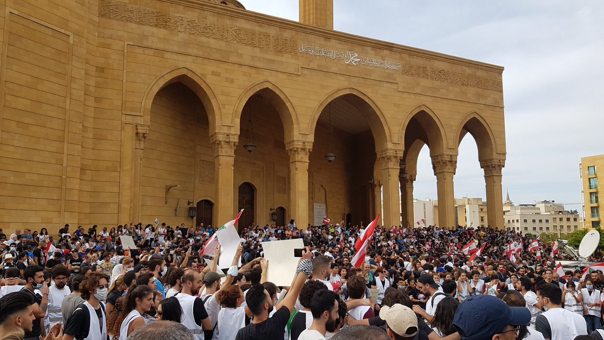 Beirut's Martyrs Square: Several thousand people. Chants of Revolution. Smell of smoke from nearby fires