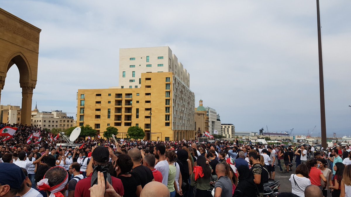 Beirut's Martyrs Square: Several thousand people. Chants of Revolution. Smell of smoke from nearby fires