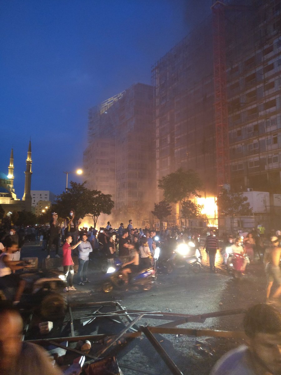 A building in central Beirut currently burning fiercely. Protestors forced back a fire truck arriving at the scene