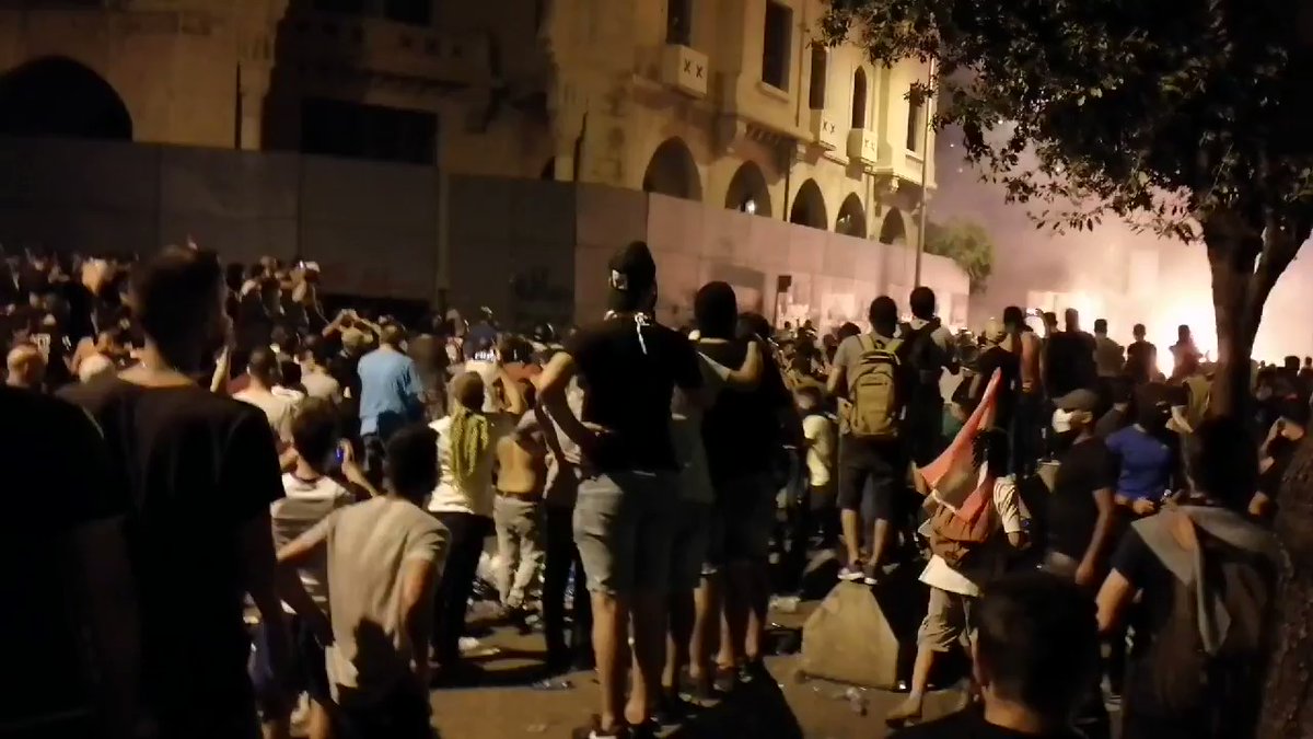 Tear gas in downtown Beirut right   as demonstrators attack buildings