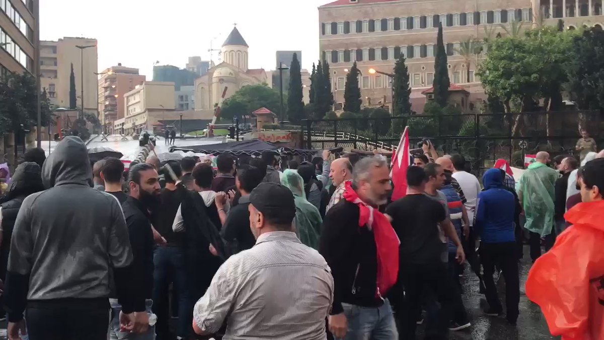 A truck of protesters scuffle with other protesters in Riad Solh square because they insulted Hassan Nasrallah. Punches were thrown.