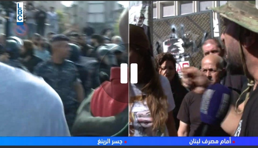 Tension in Hamra as well in Beirut where Hezbollah & Amal supporters headed to forcibly open the road. On the right the screen shows one of them having an argument with a woman protestor live on Tv and speaking to her in a threatening manner.