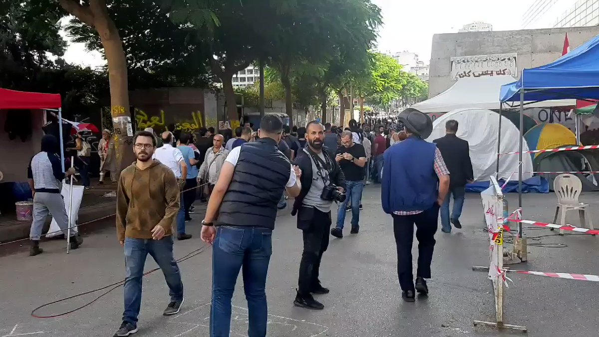 Very tense situation in Riad el Solh now, two lines of police, protesters grabbing sticks to use as makeshift weapons if needed