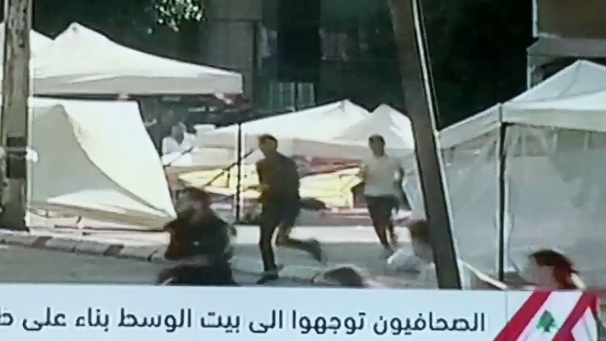 Footage (ongoing live now) of Hezbollah and Amal shabbiha destroying all the tents set up by activists, protesters, even small businesses selling food, tea and coffee . Riad El Solh and Martyrs Square now.  