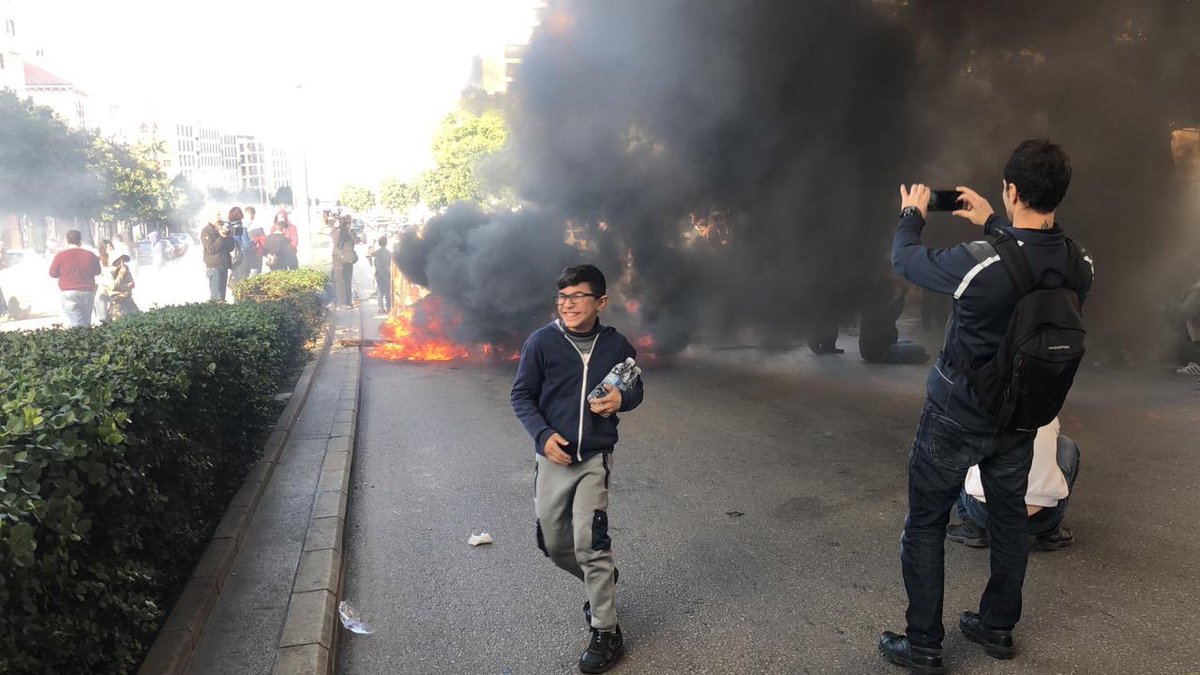 Demonstrators set tires on fire at Ring Bridge in Beirut