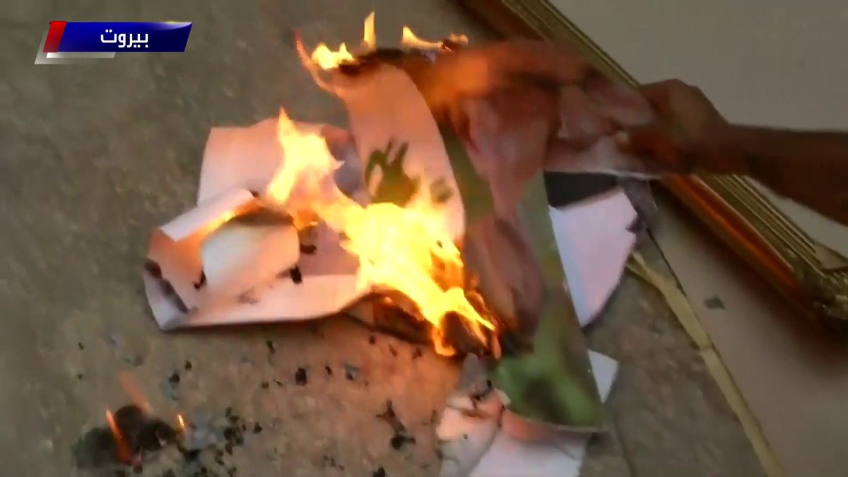 Posters of President Aoun burning at the foreign ministry