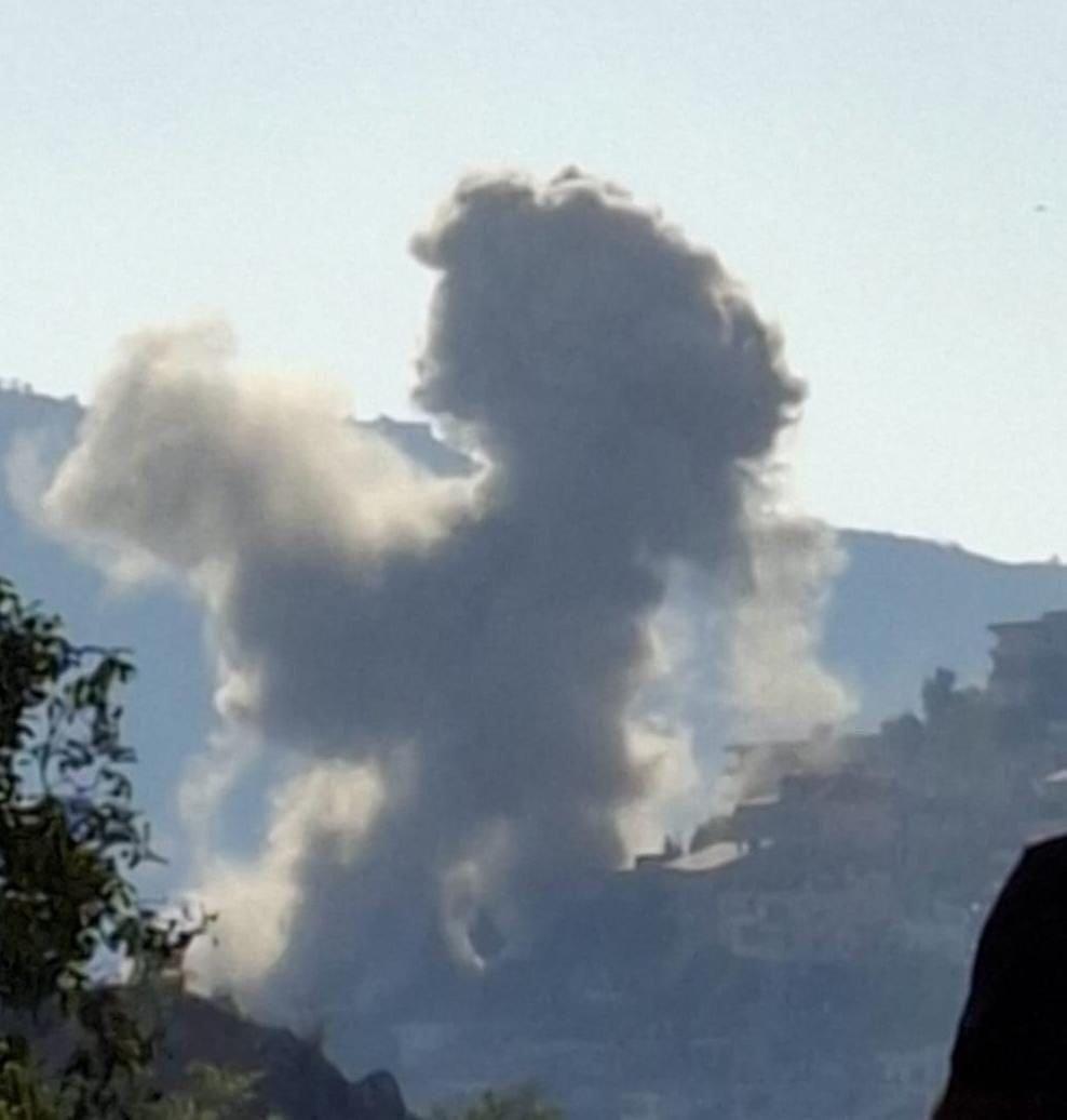 Smoke billows after an airstrike targeted an uninhabited house in the town of Jebchit, Nabatieh District