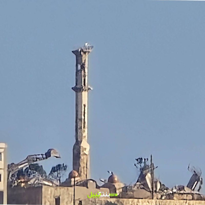 An army bulldozer demolishes what remains of a mosque in the town of Maroun al-Ras, southern Lebanon.