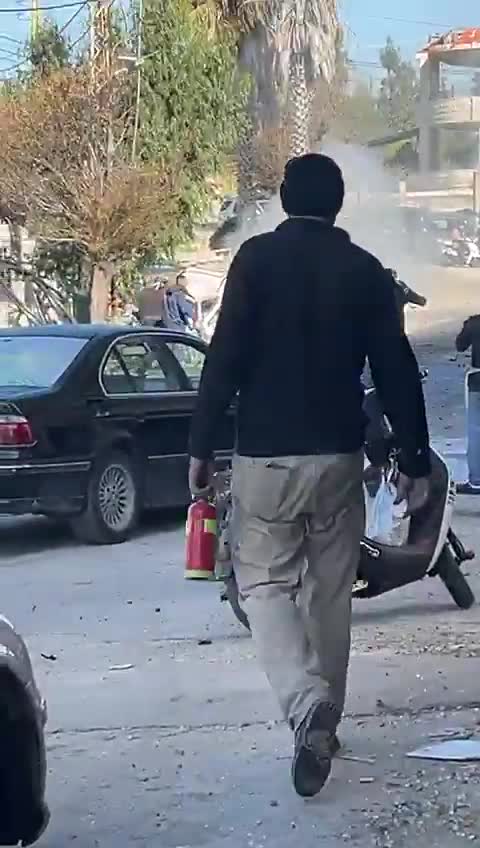 Scene from the city of Khiam after the airstrike that targeted a Rapid car