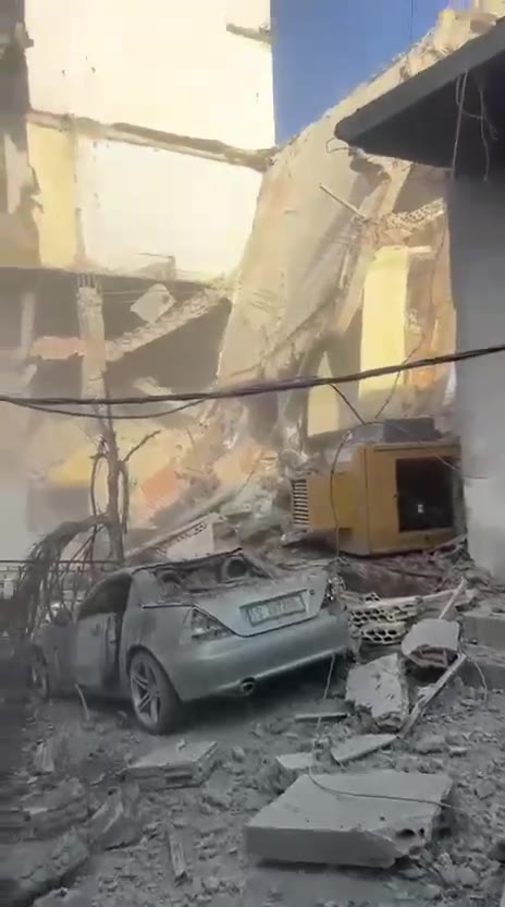 The aftermath of a violent air raid on the town of Bazouriyeh in southern Lebanon