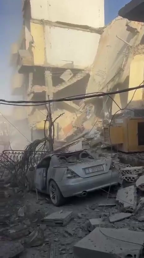 The aftermath of a violent air raid on the town of Bazouriyeh in southern Lebanon