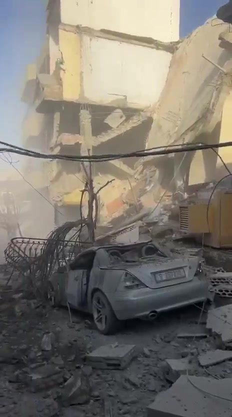 The aftermath of a violent air raid on the town of Bazouriyeh in southern Lebanon