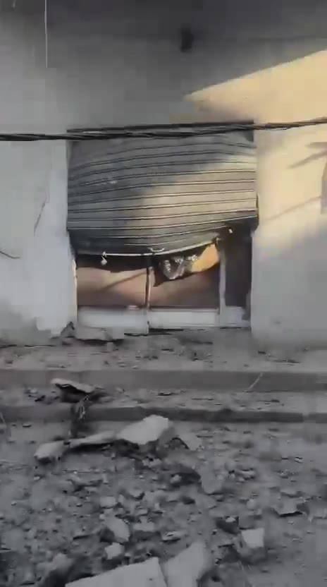 The aftermath of a violent air raid on the town of Bazouriyeh in southern Lebanon