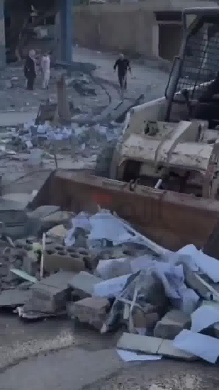 The aftermath of the Israeli airstrike that targeted the Al-Qard Al-Hasan building in Haboush
