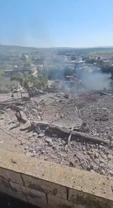 The aftermath of the bombing in the town of Kafr Tebnit in southern Lebanon following an airstrike.