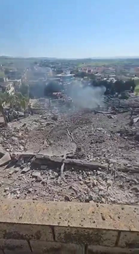 The aftermath of the bombing in the town of Kafr Tebnit in southern Lebanon following an airstrike.