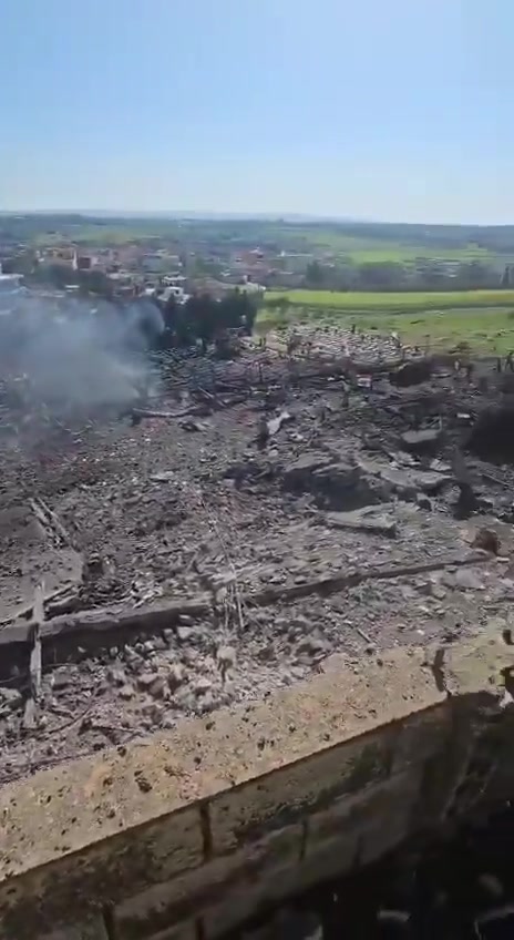 The aftermath of the bombing in the town of Kafr Tebnit in southern Lebanon following an airstrike.