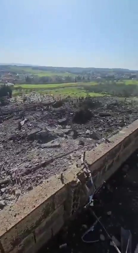 The aftermath of the bombing in the town of Kafr Tebnit in southern Lebanon following an airstrike.