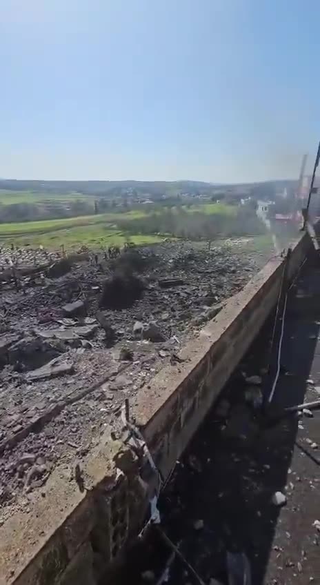The aftermath of the bombing in the town of Kafr Tebnit in southern Lebanon following an airstrike.