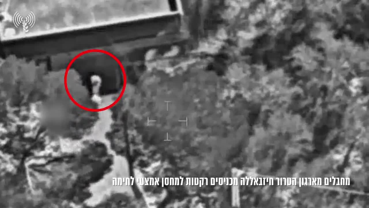 The Israeli army publishes footage showing what it says are Hezbollah operatives loading rockets into a weapons depot in southern Lebanon town of Mjadel yesterday, and a subsequent airstrike on the site