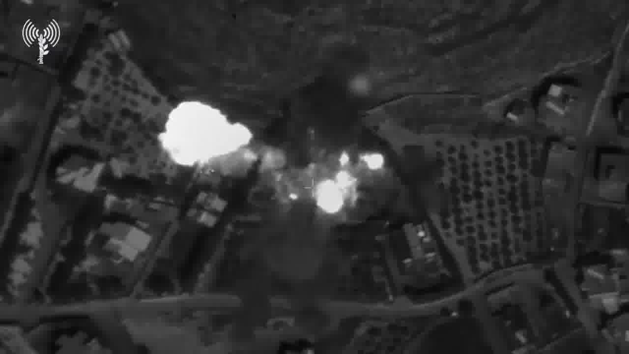 The Israeli army publishes footage showing what it says are Hezbollah operatives loading rockets into a weapons depot in southern Lebanon town of Mjadel yesterday, and a subsequent airstrike on the site