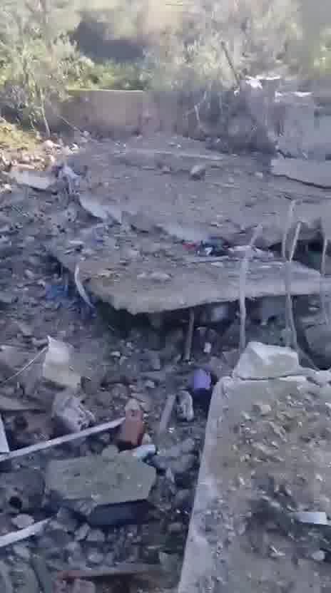 Destruction caused by the airstrike that targeted a house in the town of Al-Duwayr