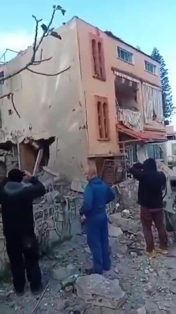 The scene from the town of Sir al-Gharbiya after it was targeted by an Israeli airstrike.
