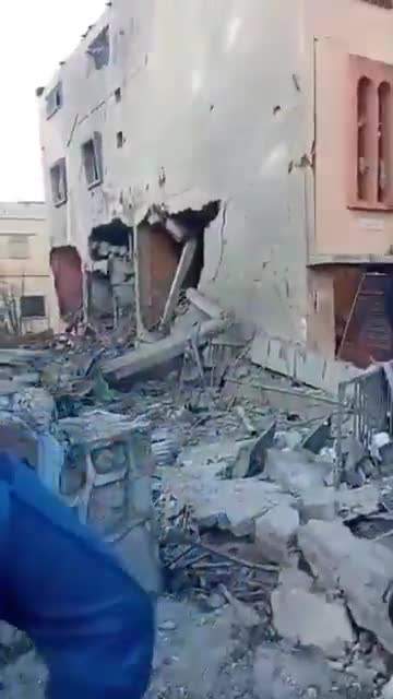 The scene from the town of Sir al-Gharbiya after it was targeted by an Israeli airstrike.