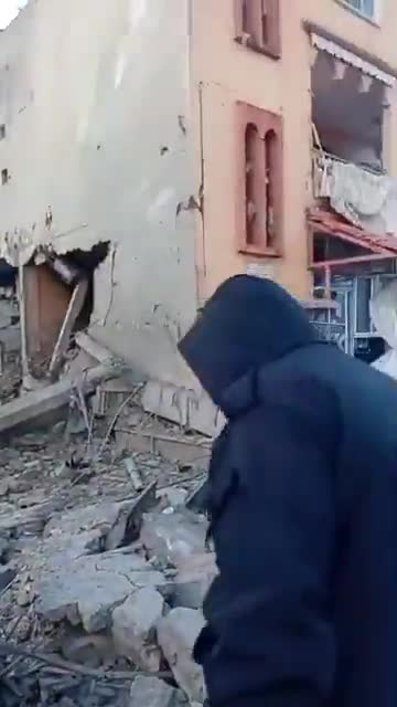 The scene from the town of Sir al-Gharbiya after it was targeted by an Israeli airstrike.